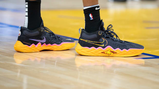 San Antonio Spurs center Victor Wembanyama's black and orange Nike shoes.